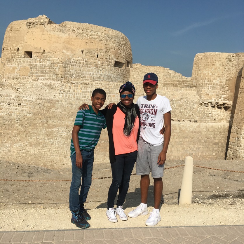 My boys and I in front Qal'at al-Bahrain